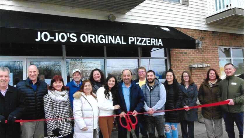 Group of People including owner Abe Mahmoud & His Family, Staff & Friends at the Ribbon Cutting Ceremony in front of Original Jo-Jo's Pizzeria Mayberry Square Location in Sylvania, Ohio