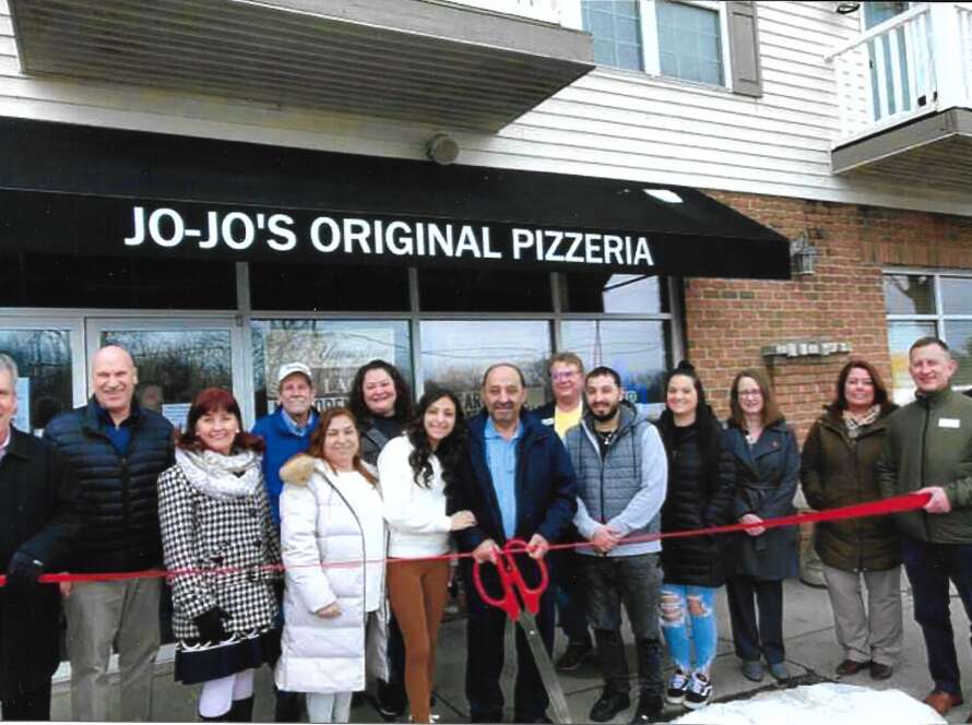 Group of People including owner Abe Mahmoud & His Family, Staff & Friends at the Ribbon Cutting Ceremony in front of Original Jo-Jo's Pizzeria Mayberry Square Location in Sylvania, Ohio